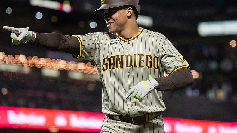 Sep 26, 2023; San Francisco, California, USA; San Diego Padres left fielder Juan Soto (22) points to hit team mates after hitting a home run during the seventh inning against the San Francisco Giants at Oracle Park. Mandatory Credit: Ed Szczepanski-USA TODAY Sports