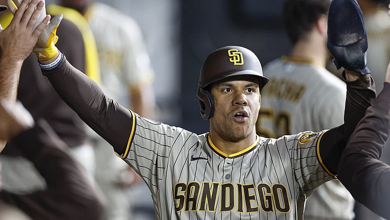 Sep 30, 2023; Chicago, Illinois, USA; San Diego Padres left fielder Juan Soto (22) celebrates with teammates after scoring against the Chicago White Sox during the second inning at Guaranteed Rate Field. Mandatory Credit: Kamil Krzaczynski-USA TODAY Sports