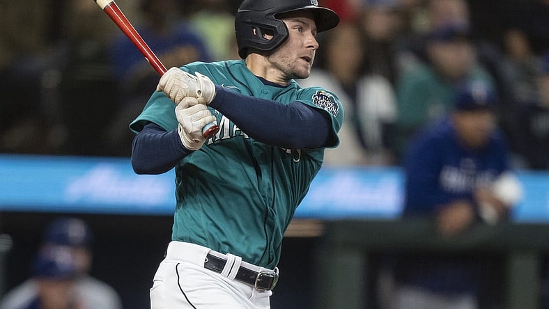 Sep 30, 2023; Seattle, Washington, USA; Seattle Mariners pinch hitter Jarred Kelenic (10) hits a single during the sixth inning against the Texas Rangers at T-Mobile Park. Mandatory Credit: Stephen Brashear-USA TODAY Sports
