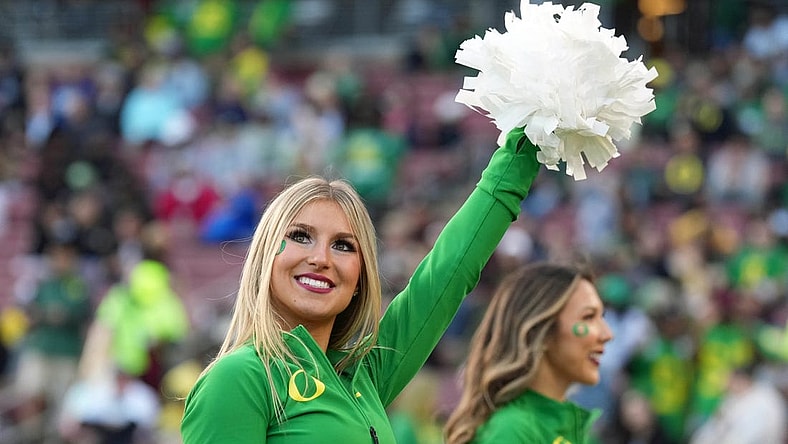 Sep 30, 2023; Stanford, California, USA; An Oregon Ducks cheerleader performs during the third quarter against the Stanford Cardinal at Stanford Stadium. Mandatory Credit: Darren Yamashita-USA TODAY Sports