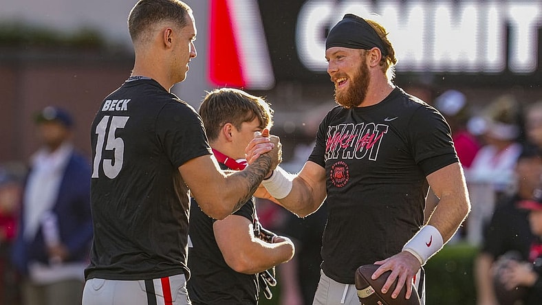 Georgia Bulldogs quarterbacks Carson Beck (15) and quarterback Brock Vandagriff (12) react on the field prior to the game against the Kentucky Wildcats at Sanford Stadium. Mandatory Credit: Dale Zanine-USA TODAY Sports