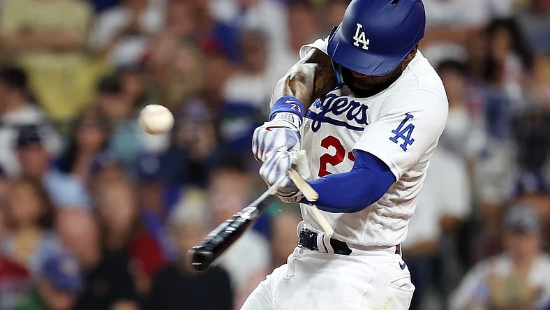 Oct 7, 2023; Los Angeles, California, USA; Los Angeles Dodgers right fielder Jason Heyward (23) breaks a bat on a fly ball against the Arizona Diamondbacks during the second inning for game one of the NLDS for the 2023 MLB playoffs at Dodger Stadium. Mandatory Credit: Kiyoshi Mio-USA TODAY Sports