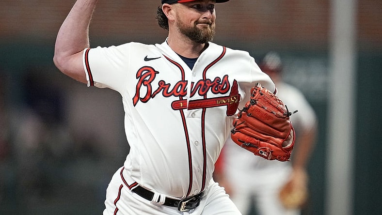 Oct 9, 2023; Cumberland, Georgia, USA; Atlanta Braves relief pitcher Kirby Yates (22) pitches during the fifth inning against the Philadelphia Phillies in game two of the NLDS for the 2023 MLB playoffs at Truist Park. Mandatory Credit: Dale Zanine-USA TODAY Sports