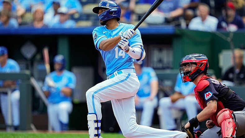 Sep 20, 2023; Kansas City, Missouri, USA; Kansas City Royals left fielder Edward Olivares (14) bats during the third inning against the Cleveland Guardians at Kauffman Stadium. Mandatory Credit: Jay Biggerstaff-USA TODAY Sports