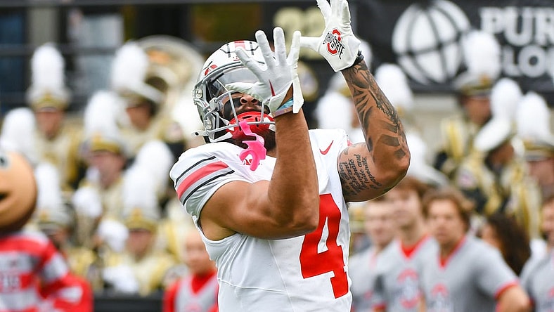 Oct 14, 2023; West Lafayette, Indiana, USA;  Ohio State Buckeyes wide receiver Julian Fleming (4) catches a pass during warmups prior to the game at Ross-Ade Stadium. Mandatory Credit: Robert Goddin-USA TODAY Sports