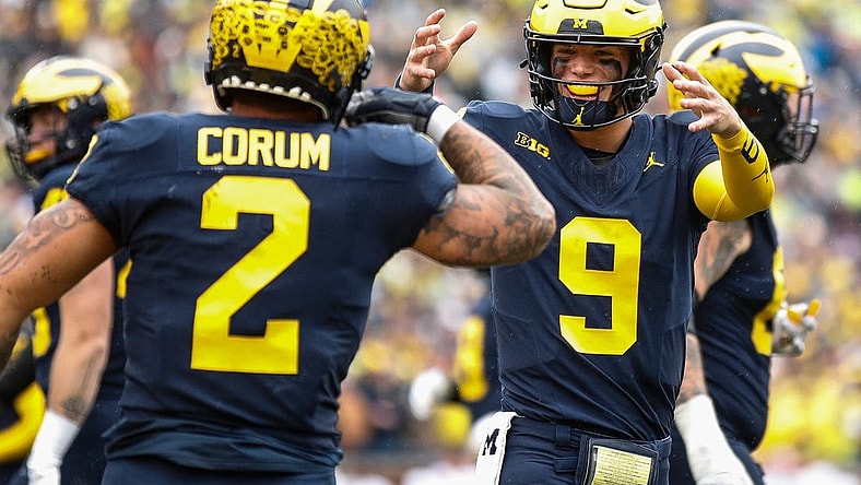 Michigan quarterback J.J. McCarthy celebrates a touchdown against Indiana scored by running back Blake Corum during the first half of U-M's 52-7 win over Indiana on Saturday, Oct. 14, 2023, in Ann Arbor.