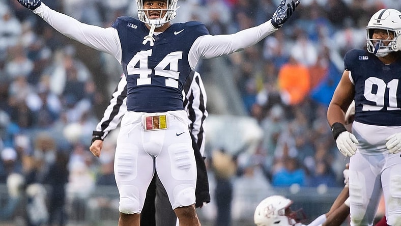Penn State defensive end Chop Robinson (44) celebrates after sacking Massachusetts quarterback Taisun Phommachanh in the first half of a NCAA football game Saturday, Oct. 14, 2023, in State College, Pa. The Nittany Lions won, 63-0.