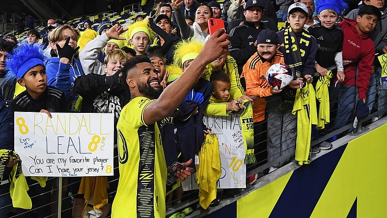 Oct 14, 2023; Nashville, Tennessee, USA; Nashville SC midfielder Anibal Godoy (20) celebrates with fans after the game against New England Revolution at Geodis Park. Mandatory Credit: Christopher Hanewinckel-USA TODAY Sports