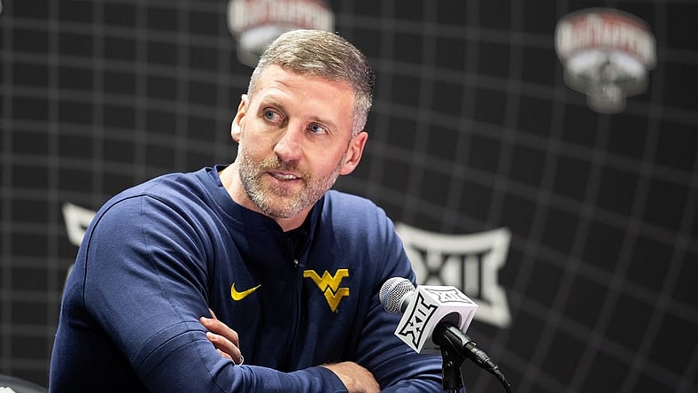 Oct 18, Kansas City, MO, USA; West Virginia interim head coach Josh Eilert answers questions at Big 12 Men s Basketball Tipoff at T-Mobile Center. Mandatory Credit: Kylie Graham-USA TODAY Sports