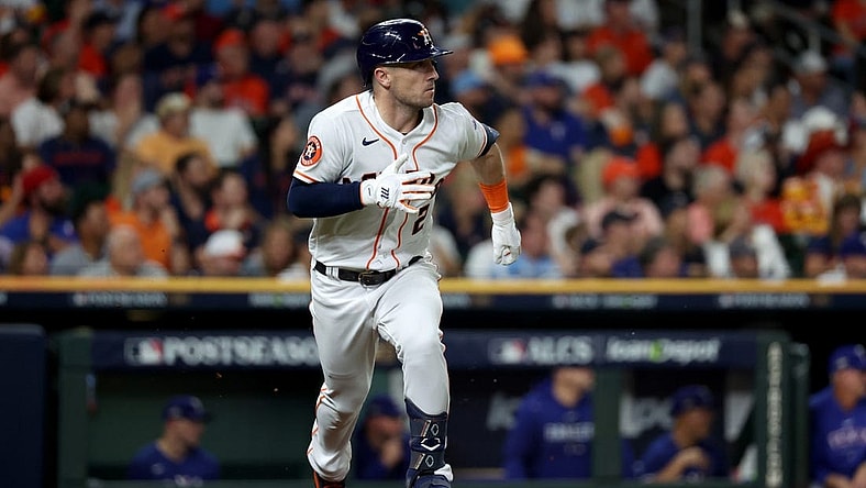Oct 23, 2023; Houston, Texas, USA; Houston Astros third baseman Alex Bregman (2) doubles during the seventh inning of game seven in the ALCS against the Texas Rangers for the 2023 MLB playoffs at Minute Maid Park. Mandatory Credit: Thomas Shea-USA TODAY Sports