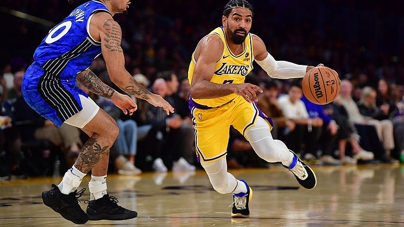 Oct 30, 2023; Los Angeles, California, USA; Los Angeles Lakers guard Gabe Vincent (7) moves to the basket against Orlando Magic guard Cole Anthony (50) during the second half at Crypto.com Arena. Mandatory Credit: Gary A. Vasquez-USA TODAY Sports
