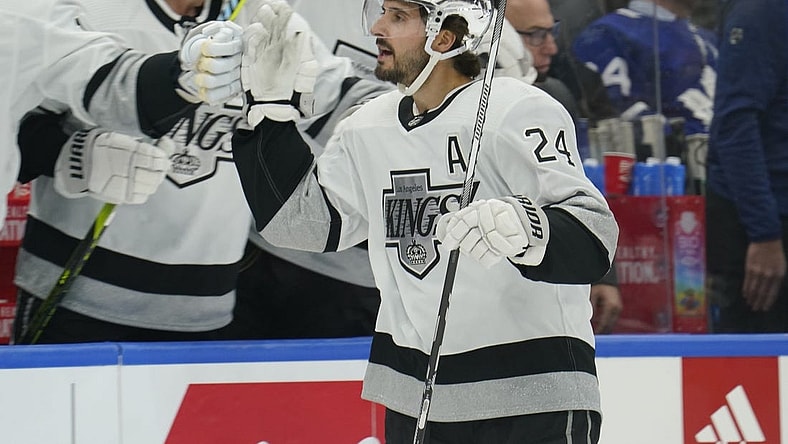 Oct 31, 2023; Toronto, Ontario, CAN; Los Angeles  Kings forward Phillip Danault (24) gets congratulated after scoring against the Toronto Maple Leafs during the first period at Scotiabank Arena. Mandatory Credit: John E. Sokolowski-USA TODAY Sports
