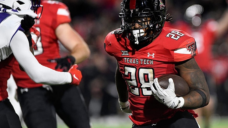 Texas Tech's running back Tahj Brooks (28) runs for a touchdown against TCU in a Big 12 football game, Thursday, Nov. 2, 2023, at Jones AT&T Stadium.