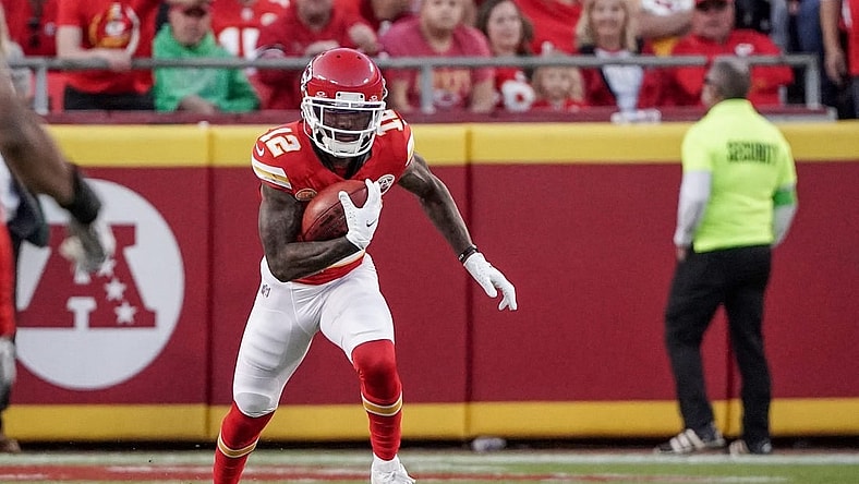 Oct 12, 2023; Kansas City, Missouri, USA; Kansas City Chiefs wide receiver Mecole Hardman Jr. (12) returns a kick against the Los Angeles Chargers during the game at GEHA Field at Arrowhead Stadium. Mandatory Credit: Denny Medley-USA TODAY Sports