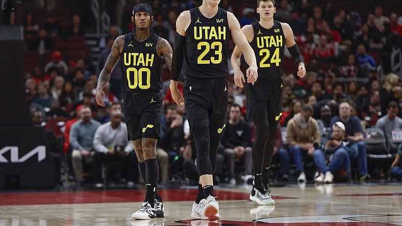 Nov 6, 2023; Chicago, Illinois, USA; Utah Jazz forward Lauri Markkanen (23), Utah Jazz guard Jordan Clarkson (00) and Utah Jazz center Walker Kessler (24) walk on the court during the first half of a basketball game against the Chicago Bulls at United Center. Mandatory Credit: Kamil Krzaczynski-USA TODAY Sports
