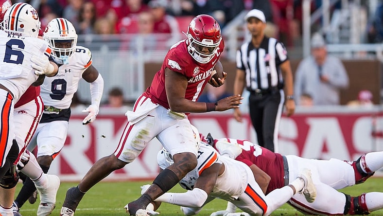 Nov 11, 2023; Fayetteville, Arkansas, USA;  Arkansas Razorbacks quarterback KJ Jefferson (1) gets past Auburn Tigers linebacker Elijah McAllister (11) during the second quarter at Donald W. Reynolds Razorback Stadium. Mandatory Credit: Brett Rojo-USA TODAY Sports