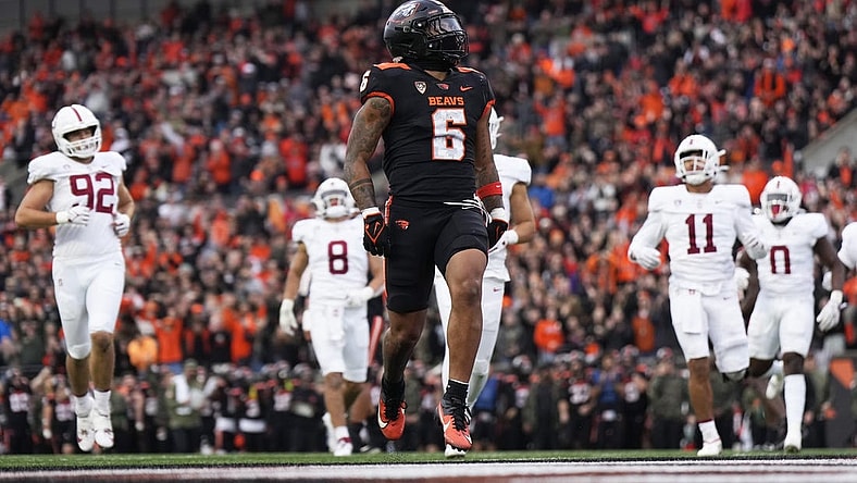 Nov 11, 2023; Corvallis, Oregon, USA; Oregon State Beavers running back Damien Martinez (6) runs with the ball for a touchdown during the first half against the Stanford Cardinal at Reser Stadium. Mandatory Credit: Soobum Im-USA TODAY Sports