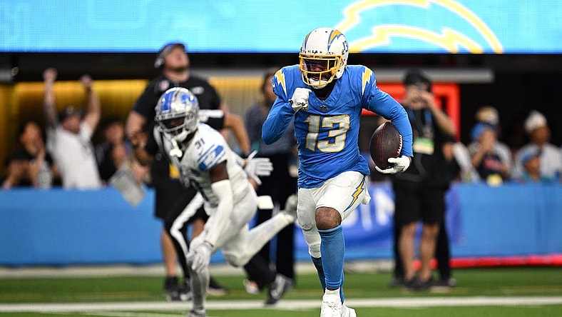 Nov 12, 2023; Inglewood, California, USA; Los Angeles Chargers wide receiver Keenan Allen (13) runs the ball for a touchdown after a catch against the Detroit Lions during the second half at SoFi Stadium. Mandatory Credit: Orlando Ramirez-USA TODAY Sports