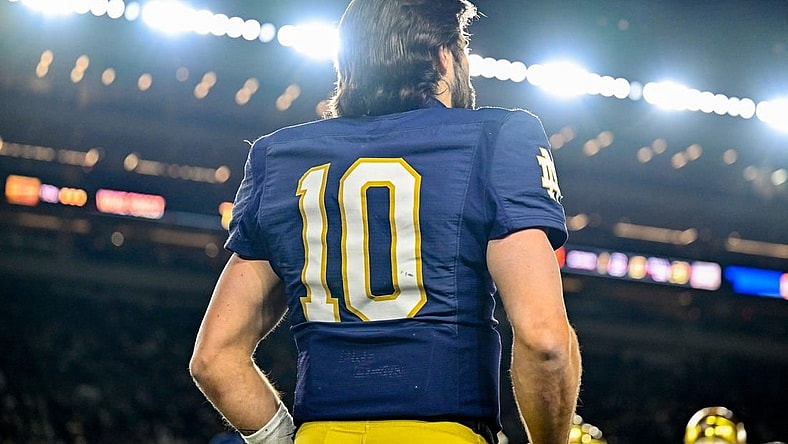 Nov 18, 2023; South Bend, Indiana, USA; Notre Dame Fighting Irish quarterback Sam Hartman (10) watches from the bench in the fourth quarter against the Wake Forest Demon Deacons at Notre Dame Stadium. Mandatory Credit: Matt Cashore-USA TODAY Sports