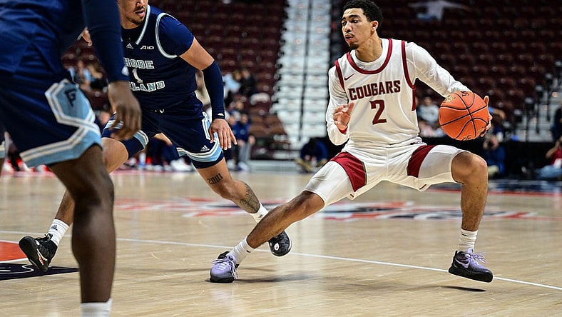 Nov 19, 2023; Uncasville, CT, USA; Washington State Cougars guard Myles Rice (2) dribbles the ball defended by Rhode Island Rams guard Luis Kortright (1) during the second half at Mohegan Sun Arena. Mandatory Credit: Mark Smith-USA TODAY Sports