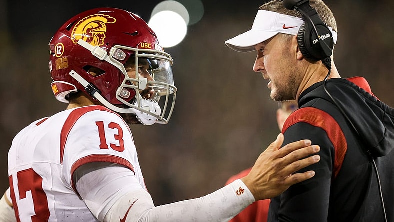 USC Trojans quarterback Caleb Williams talks with USC Trojans head coach Lincoln Riley during the first half of the game against No. 6 Oregon Ducks on Saturday, Nov. 11, 2023, at Autzen Stadium in Eugene, Ore.