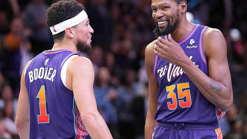 Nov 21, 2023; Phoenix, Arizona, USA; Phoenix Suns guard Devin Booker (1) and Phoenix Suns forward Kevin Durant (35) look on against the Portland Trail Blazers during the second half at Footprint Center. Mandatory Credit: Joe Camporeale-USA TODAY Sports