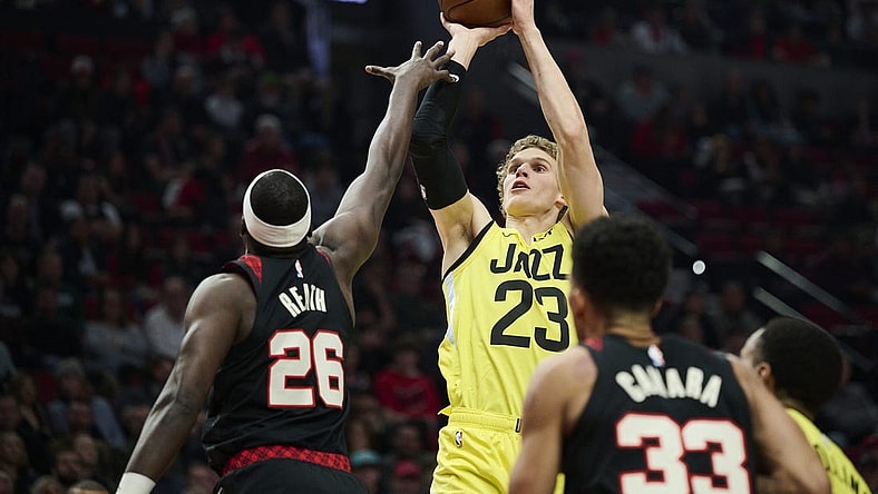 Nov 22, 2023; Portland, Oregon, USA; Utah Jazz forward Lauri Markkanen (23) shoots a jump shot during the first half against Portland Trail Blazers center Duop Reath (26) at Moda Center. Mandatory Credit: Troy Wayrynen-USA TODAY Sports