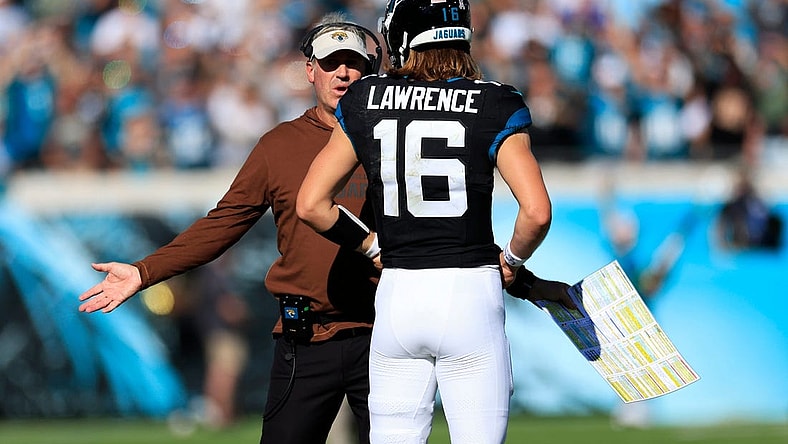 Jacksonville Jaguars head coach Doug Pederson talks with quarterback Trevor Lawrence (16) during the second quarter an NFL football matchup Sunday, Nov. 19, 2023 at EverBank Stadium in Jacksonville, Fla. The Jacksonville Jaguars defeated the Tennessee Titans 34-14. [Corey Perrine/Florida Times-Union]