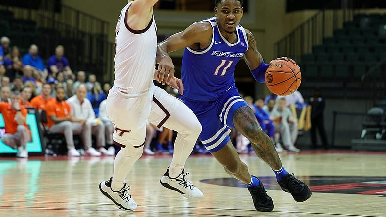 Nov 23, 2023; Kissimmee, FL, USA;  Boise State Broncos guard Chibuzo Agbo (11) drives past Virginia Tech Hokies guard Sean Pedulla (3) in the first half during the ESPN Events Invitational at State Farm Field House. Mandatory Credit: Nathan Ray Seebeck-USA TODAY Sports