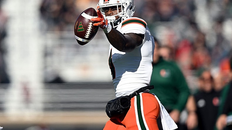 Nov 24, 2023; Chestnut Hill, Massachusetts, USA; Miami Hurricanes wide receiver Colbie Young (4) reacts after making a reception against the Boston College Eagles during the first half at Alumni Stadium. Mandatory Credit: Brian Fluharty-USA TODAY Sports