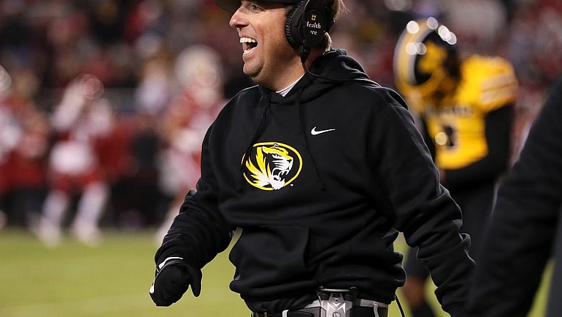Nov 24, 2023; Fayetteville, Arkansas, USA; Missouri Tigers head coach Eli Drinkwitz celebrates after a defensive touchdown in the third quarter against the Arkansas Razorbacks at Donald W. Reynolds Razorback Stadium. Missouri won 48-14. Mandatory Credit: Nelson Chenault-USA TODAY Sports