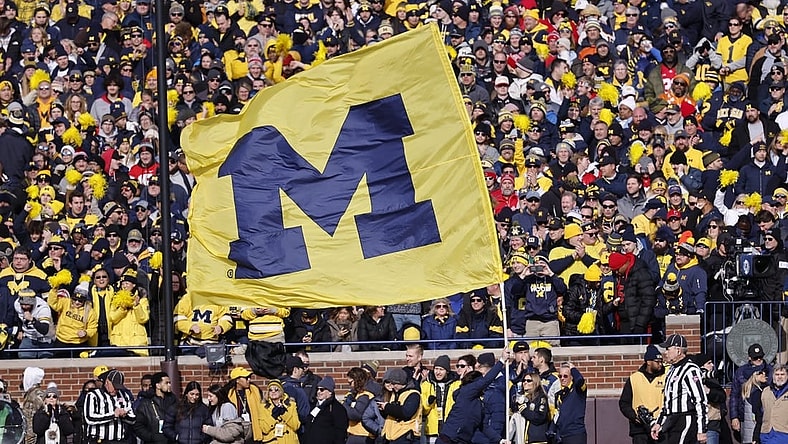 Nov 25, 2023; Ann Arbor, Michigan, USA; Michigan Wolverines cheerleader celebrates a touchdown against the Ohio State Buckeyes in the first half at Michigan Stadium. Mandatory Credit: Rick Osentoski-USA TODAY Sports