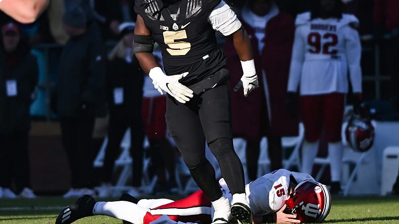 Nov 25, 2023; West Lafayette, Indiana, USA; Purdue Boilermakers linebacker Nic Scourton (5) reacts after bringing down Indiana Hoosiers quarterback Brendan Sorsby (15) during the second half at Ross-Ade Stadium. Mandatory Credit: Robert Goddin-USA TODAY Sports