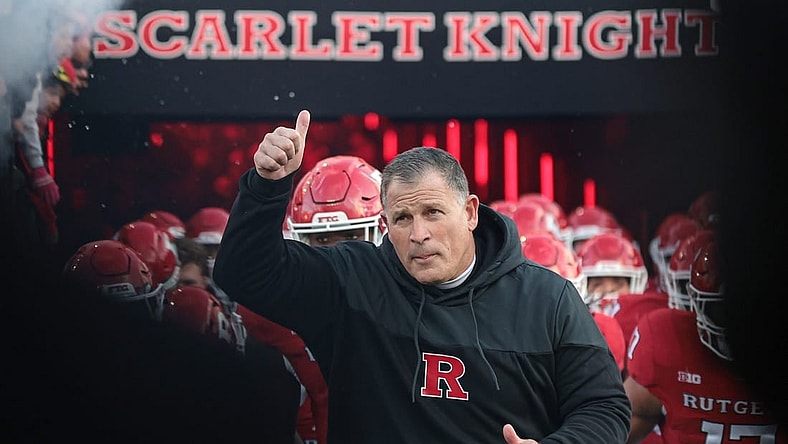 Nov 25, 2023; Piscataway, New Jersey, USA; Rutgers Scarlet Knights head coach Greg Schiano runs out to the field with his team before the game against the Maryland Terrapins at SHI Stadium. Mandatory Credit: Vincent Carchietta-USA TODAY Sports