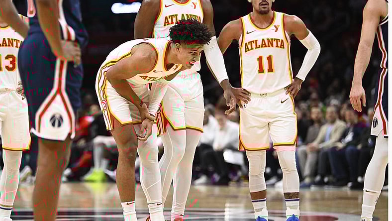 Nov 25, 2023; Washington, District of Columbia, USA; Atlanta Hawks forward Jalen Johnson (1) grabs his arm after suffering an apparent injury against the Washington Wizards during the first half at Capital One Arena. Mandatory Credit: Brad Mills-USA TODAY Sports