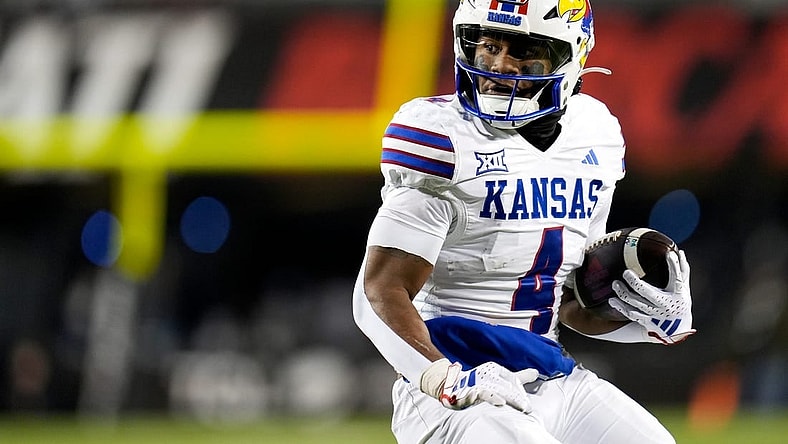 Kansas Jayhawks running back Devin Neal (4) scores a touch down during the NCAA college football game between the Cincinnati Bearcats and Kansas Jayhawks on Saturday, Nov. 25, 2023, at Nippert Stadium in Cincinnati. This is the Bearcats    last game of the season, as well as their Senior Night Saturday.