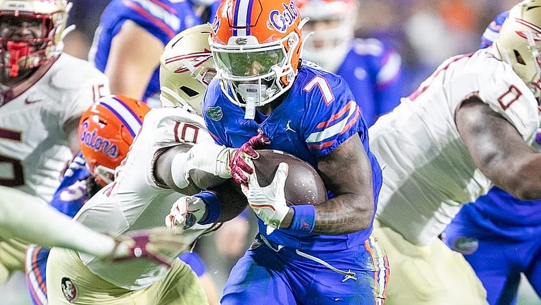 Florida Gators running back Trevor Etienne (7) makes yards during first half action as Florida takes on Florida State at Steve Spurrier Field at Ben Hill Griffin Stadium in Gainesville, FL on Saturday, November 25, 2023. [Alan Youngblood/Gainesville Sun]
