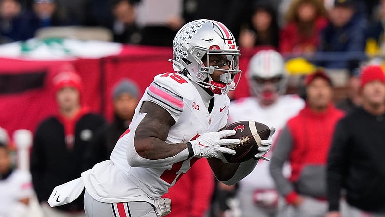Nov 25, 2023; Ann Arbor, Michigan, USA; Ohio State Buckeyes running back Chip Trayanum (19) carries the ball during the NCAA football game against the Michigan Wolverines at Michigan Stadium. Ohio State lost 30-24.