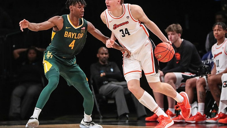 Nov 22, 2023; Brooklyn, NY, USA;  Oregon State Beavers forward Tyler Bilodeau (34) and Baylor Bears guard Ja'Kobe Walter (4) at Barclay Center. Mandatory Credit: Wendell Cruz-USA TODAY Sports