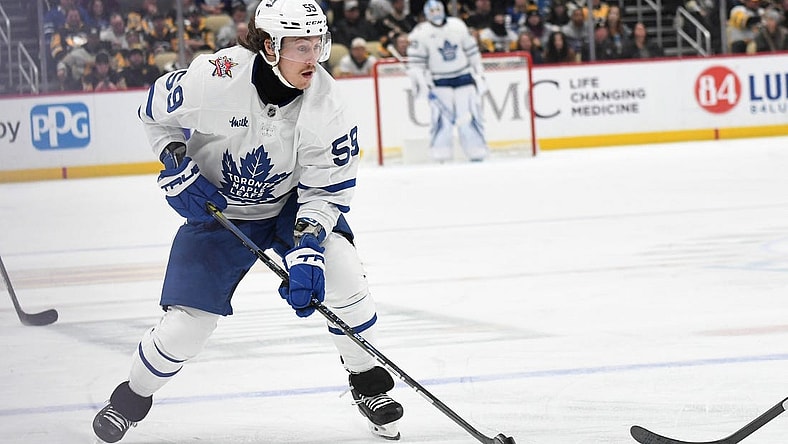 Nov 25, 2023; Pittsburgh, Pennsylvania, USA;  Toronto Maple Leafs left wing Tyler Bertuzzi (59) moves the puck against the Pittsburgh Penguins during the second period at PPG Paints Arena. Mandatory Credit: Philip G. Pavely-USA TODAY Sports
