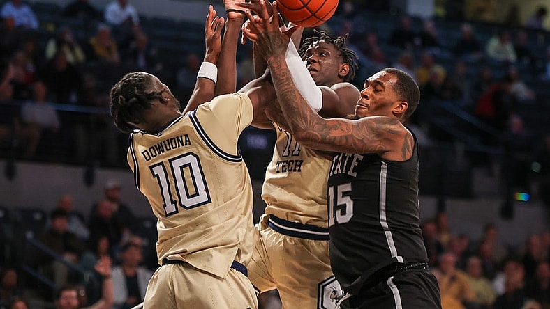 Nov 28, 2023; Atlanta, Georgia, USA; Georgia Tech Yellow Jackets forward Ebenezer Dowuona (10) and forward Baye Ndongo (11) reach for a rebound with Mississippi State Bulldogs forward Jimmy Bell Jr. (15) in the second half at McCamish Pavilion. Mandatory Credit: Brett Davis-USA TODAY Sports