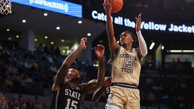 Nov 28, 2023; Atlanta, Georgia, USA; Georgia Tech Yellow Jackets guard Miles Kelly (13) shoots over Mississippi State Bulldogs forward Jimmy Bell Jr. (15) in the second half at McCamish Pavilion. Mandatory Credit: Brett Davis-USA TODAY Sports