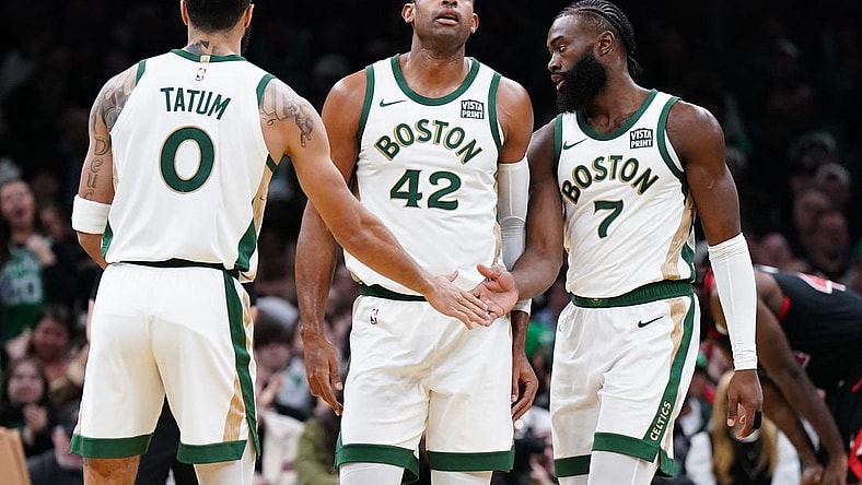 Nov 28, 2023; Boston, Massachusetts, USA; Boston Celtics guard Jaylen Brown (7) with forward Jayson Tatum (0) and center Al Horford (42) after his basket against the Chicago Bulls in the second half at TD Garden. Mandatory Credit: David Butler II-USA TODAY Sports