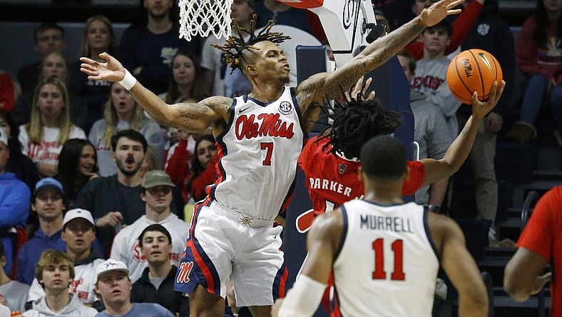 Nov 28, 2023; Oxford, Mississippi, USA; Mississippi Rebels guard Allen Flanigan (7) blocks the shot of North Carolina State Wolfpack guard Dennis Parker, Jr. (11) during the second half at The Sandy and John Black Pavilion at Ole Miss. Mandatory Credit: Petre Thomas-USA TODAY Sports