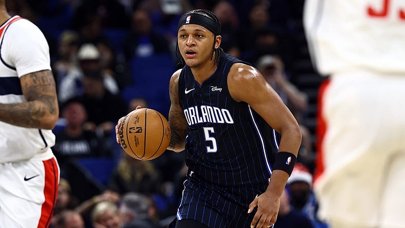 Nov 29, 2023; Orlando, Florida, USA; Orlando Magic forward Paolo Banchero (5) drives to the basket against the Washington Wizards during the first quarter at Amway Center. Mandatory Credit: Kim Klement Neitzel-USA TODAY Sports