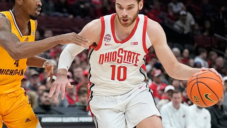 Nov 29, 2023; Columbus, OH, USA; Ohio State Buckeyes forward Jamison Battle (10) is guarded by Central Michigan Chippewas forward Jemal Davis (4) in the second half of their game at at the Schottenstein Center.