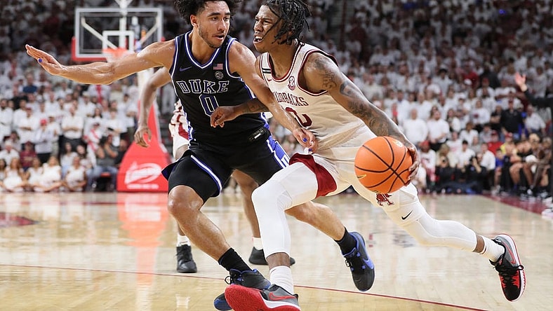 Nov 29, 2023; Fayetteville, Arkansas, USA; Arkansas Razorbacks guard Khalif Battle (0) drives against Duke Blue Devils Jared McCain (0) during the second half at Bud Walton Arena. Arkansas won 80-75. Mandatory Credit: Nelson Chenault-USA TODAY Sports