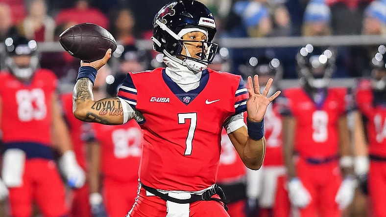 Dec 1, 2023; Lynchburg, VA, USA; Liberty Flames quarterback Kaidon Salter (7) throws a pass during the first quarter against the New Mexico State Aggies at Williams Stadium. Mandatory Credit: Brian Bishop-USA TODAY Sports