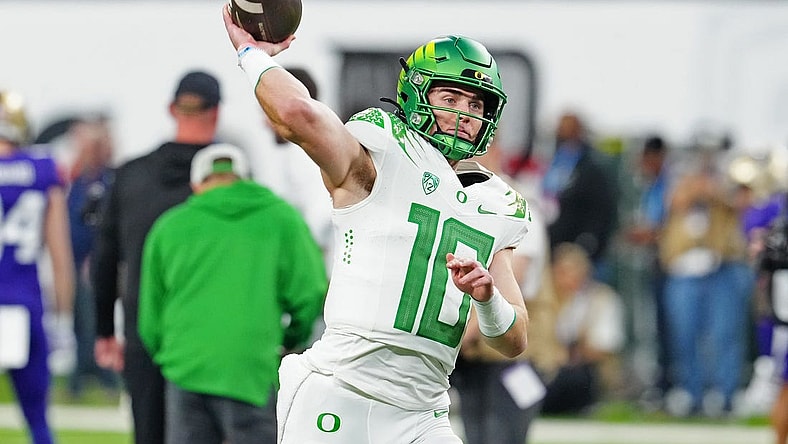 Dec 1, 2023; Las Vegas, NV, USA; Oregon Ducks quarterback Bo Nix (10) warms up before a game against the Washington Huskies at Allegiant Stadium. Mandatory Credit: Stephen R. Sylvanie-USA TODAY Sports