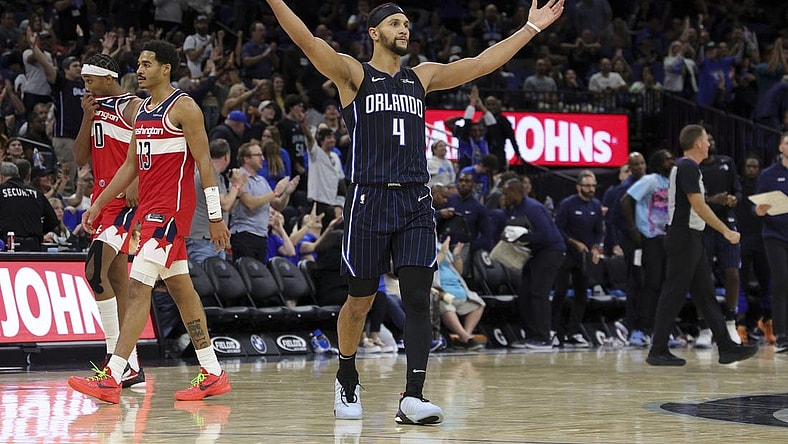 Dec 1, 2023; Orlando, Florida, USA;  Orlando Magic guard Jalen Suggs (4) reacts during a time out against the Washington Wizards in the fourth quarter at Amway Center. Mandatory Credit: Nathan Ray Seebeck-USA TODAY Sports